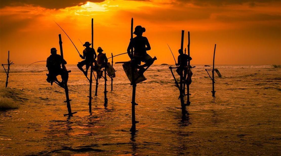 Stilt Fishermen at Sunset